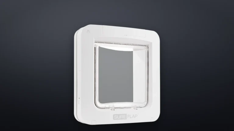 White SureFlap Microchip Pet Door Connect, angled front view with the clear flap closed and the SureFlap logo below the opening