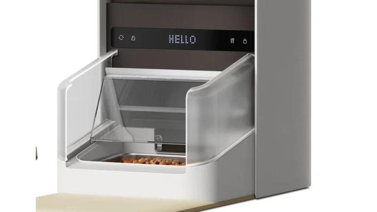 Close view of the PETLIBRO One RFID feeder's open bowl lid, the clear side shields, the stainless bowl with kibble and the control strip showing HELLO